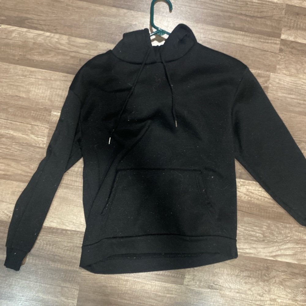 Women’s black hoodie with song lyrics on the back